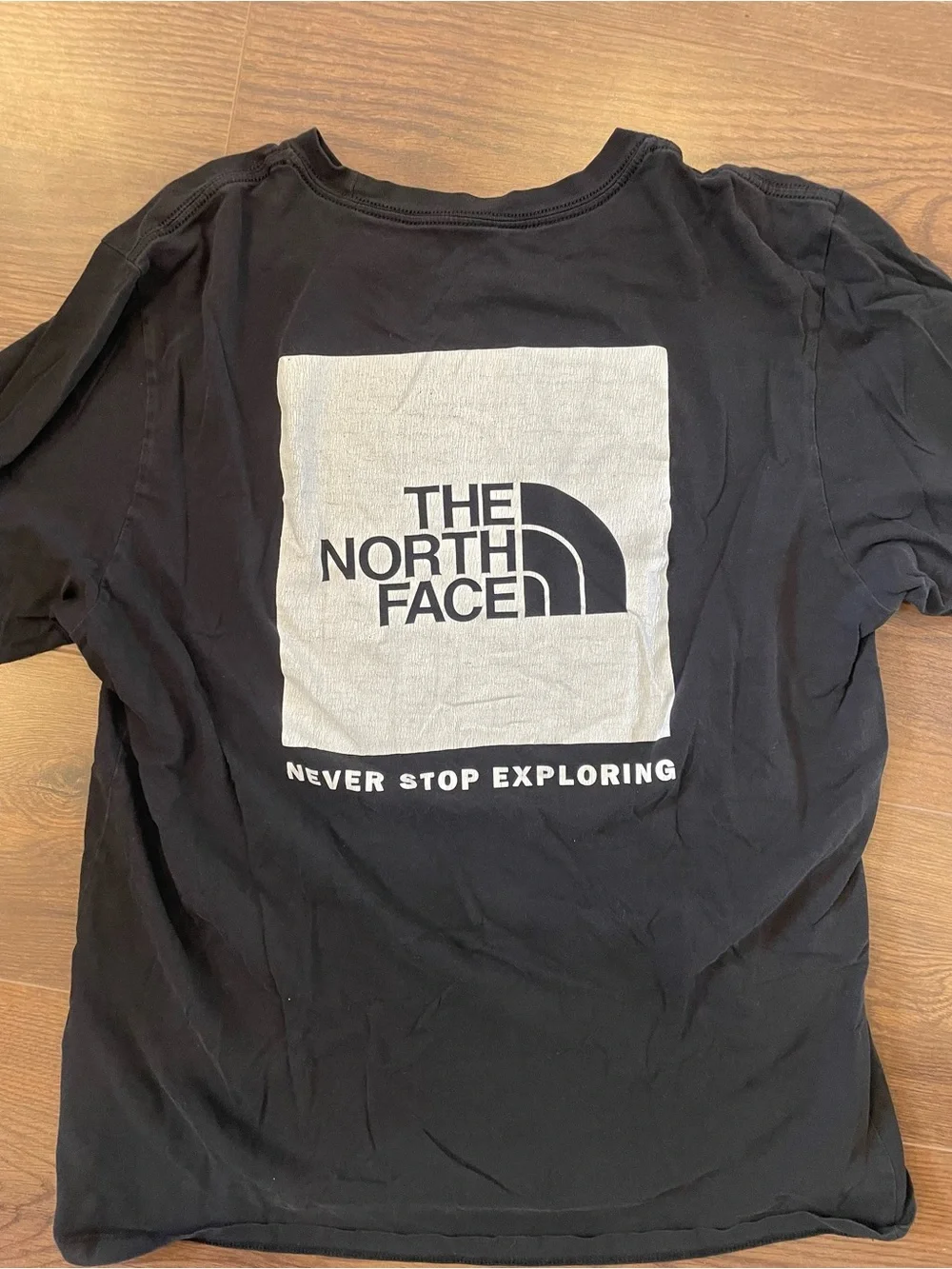 The North Face Black Graphic Tee - 'Never Stop Exploring'